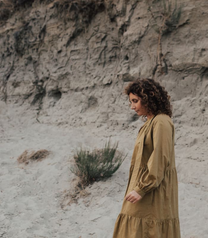 The author, Juliette Sander, in one of her own designs. Image credit: Elizabeth Podlesnik. HMU Kaija Mistral Towner