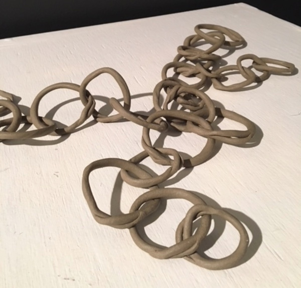"Link 7" by Hardie Cobbs, hand formed, raw clay links approx. 16" across